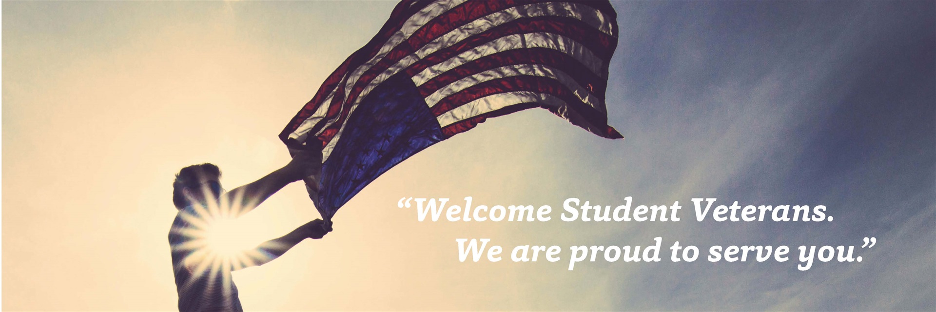 A person waves an American flag. 'Welcome Student Veterans. We are proud to serve you.'