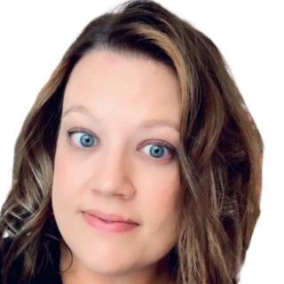 Heidi Aune (Hartley) - a smiling white woman with shoulder length brown hair wearing a black blouse.
