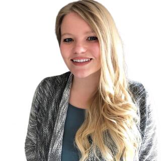 Dr. Lauren Rose Strand - A woman with blond hair wearing a cardigan over a teal blouse.